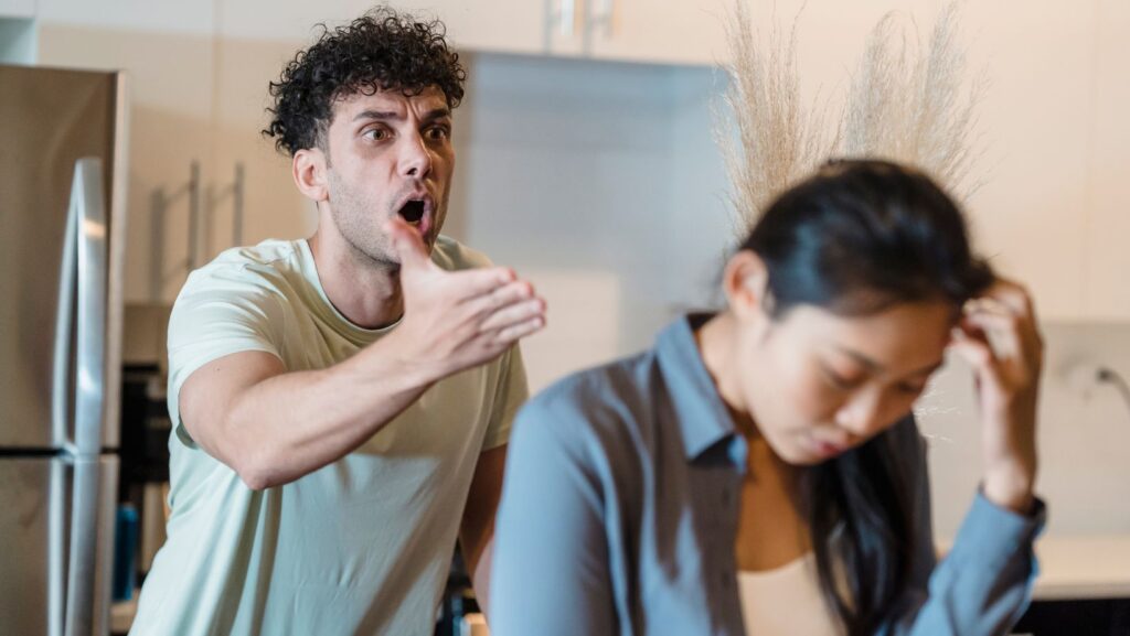 A couple arguing. One of the elements of plot in a novel is rising tension
